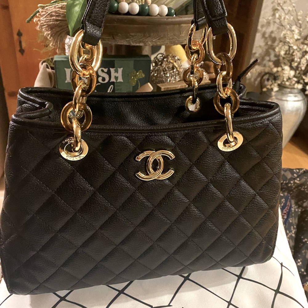 Black and gold Chanel lamb skin quilted handbag